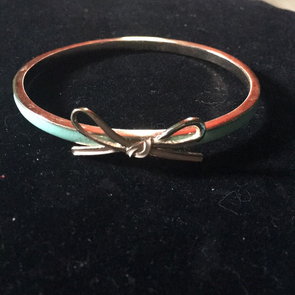 Arm cuff with bow.